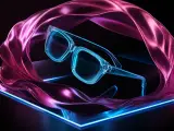 Transparent cyan glasses framed by flowing magenta fabric and neon light