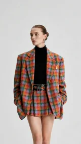 Fashion model wearing a colorful plaid suit